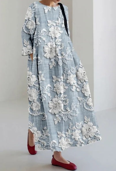 リラックスしたシルエットを備えた創造的な4分の3のフローラルドレス