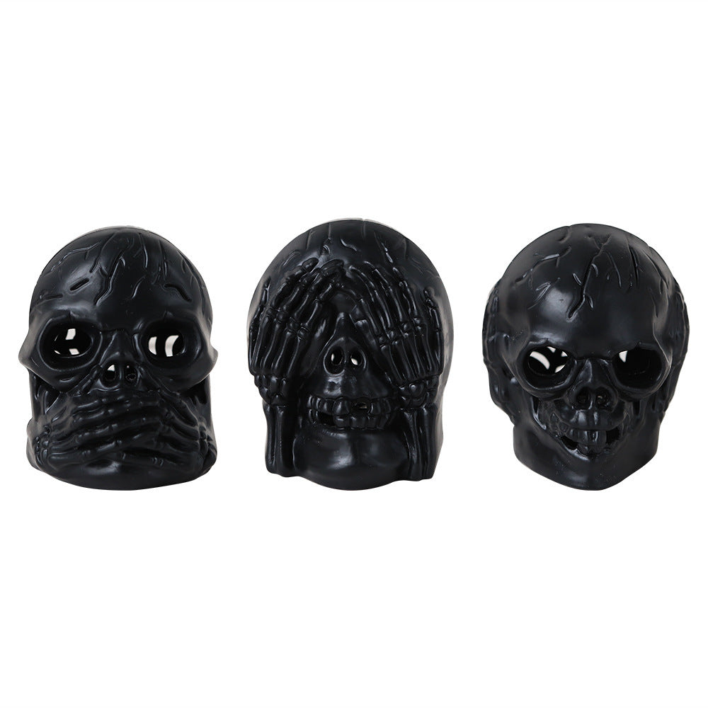 Hear No Evil, See No Evil, Speak No Evil Black Skulls with Lighted Eyes