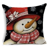 笑顔の雪だるまの休日の枕が覆われています